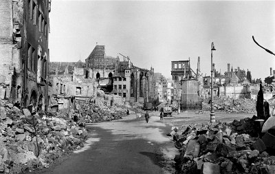 Monday 12 July, 2010     On January 2, 1945, the medieval city centre (where we are standing right now) was bombed by the R.A.F and the U.S.A.A.F. About ninety percent of it was destroyed in  one hour;  1,800 residents were  killed and roughly 100,000 were displaced. I felt a little ill when I saw this picture because this isn't ancient history for me.  I was five years old when this madness happened.